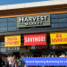 Grand opening marketing for a new grocery store with banners and shoppers.